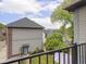 View of the backyard from a balcony, showcasing the yard, gardens, and surrounding homes at 914 N College Ave, Indianapolis, IN 46202