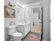The bathroom features updated fixtures, tile flooring, and artwork at 914 N College Ave, Indianapolis, IN 46202