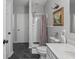 Comfortable bathroom with tile flooring, a standing shower, and bright overhead lighting at 914 N College Ave, Indianapolis, IN 46202
