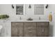 Bathroom featuring a double vanity with a quartz countertop, and modern fixtures at 914 N College Ave, Indianapolis, IN 46202