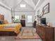 Spacious bedroom featuring vaulted ceilings, ample natural light, and unique decor at 914 N College Ave, Indianapolis, IN 46202