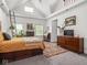 Bright bedroom features vaulted ceilings, natural light, beautiful decor, and stylish furnishings at 914 N College Ave, Indianapolis, IN 46202