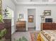 This bedroom features warm accents, plants, and natural light at 914 N College Ave, Indianapolis, IN 46202