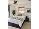 Bright bedroom with a ceiling fan, ample natural light and storage drawers under the bed at 914 N College Ave, Indianapolis, IN 46202