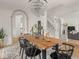 Open-concept dining room features a unique chandelier and access to multiple rooms of the house at 914 N College Ave, Indianapolis, IN 46202