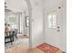 Entryway with decorative glass door and views into a dining area at 914 N College Ave, Indianapolis, IN 46202