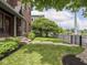 Well-maintained front yard features lush lawn, decorative fence, and mature shade trees at 914 N College Ave, Indianapolis, IN 46202