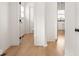 Hallway leads to a well-lit bathroom and kitchen at 914 N College Ave, Indianapolis, IN 46202