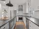 Beautiful kitchen features white cabinetry, stainless steel appliances, subway tile, and a gray island at 914 N College Ave, Indianapolis, IN 46202