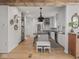 Stylish kitchen features white cabinetry, stainless appliances, a gray island, and an open layout at 914 N College Ave, Indianapolis, IN 46202