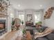 Bright living room with fireplace, large sectional sofa, wood floors and lots of natural light at 914 N College Ave, Indianapolis, IN 46202