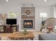 Stylish living room featuring a decorative fireplace and hardwood floors at 914 N College Ave, Indianapolis, IN 46202