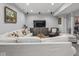 Comfortable living room with large sofa, modern TV console, and recessed lighting, great for relaxing and entertaining at 914 N College Ave, Indianapolis, IN 46202