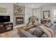 Charming living room featuring a decorative fireplace, plush gray sectional sofa, and stylish decor at 914 N College Ave, Indianapolis, IN 46202