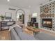 Bright living room featuring hardwood floors, fireplace, and an open layout at 914 N College Ave, Indianapolis, IN 46202