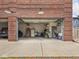 View of open garage with storage and accessories at 914 N College Ave, Indianapolis, IN 46202