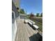 Outdoor deck with comfortable lounge seating, alongside the well-maintained backyard at 951 N Maiellen Dr, Greenfield, IN 46140