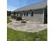 Outdoor patio with stone pavers, rock accents, and a built-in fire pit at 951 N Maiellen Dr, Greenfield, IN 46140