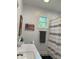 Bright bathroom with a marble vanity, towel rack, and decorative patriotic wall art at 951 N Maiellen Dr, Greenfield, IN 46140