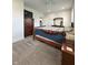 Large primary bedroom with neutral carpet, ceiling fan, and view of an adjacent dresser and mirror at 951 N Maiellen Dr, Greenfield, IN 46140