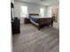 Large primary bedroom includes neutral carpet, a ceiling fan, and two windows for natural light at 951 N Maiellen Dr, Greenfield, IN 46140
