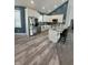 Bright kitchen with stainless steel appliances, granite countertops, and hardwood floors at 951 N Maiellen Dr, Greenfield, IN 46140