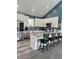 Modern kitchen with white cabinetry, stainless steel appliances and a large center island at 951 N Maiellen Dr, Greenfield, IN 46140