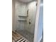 Ensuite bathroom's glass enclosed shower features marble-patterned tiling and built-in shelves at 951 N Maiellen Dr, Greenfield, IN 46140