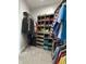 Organized walk-in closet with custom shelving and hanging rods for efficient clothing storage at 951 N Maiellen Dr, Greenfield, IN 46140