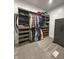 Spacious walk-in closet with custom closet system and shelving, plus secure Winchester safe at 951 N Maiellen Dr, Greenfield, IN 46140