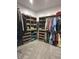 Custom walk-in closet featuring lots of hanging and storage space with built-in shelving and drawers at 951 N Maiellen Dr, Greenfield, IN 46140