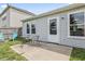 Cozy backyard featuring a concrete patio with outdoor seating and well-maintained lawn at 9560 W Campfire Dr, Pendleton, IN 46064