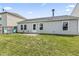 Cozy backyard featuring a patio with table and chairs, and a fire pit area at 9560 W Campfire Dr, Pendleton, IN 46064