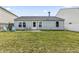 Spacious backyard with a privacy fence, a fire pit, and plenty of room to play at 9560 W Campfire Dr, Pendleton, IN 46064