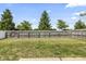 Fenced backyard featuring mature trees providing shade and privacy at 9560 W Campfire Dr, Pendleton, IN 46064