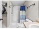 Bright bathroom featuring a shower, toilet, and a modern sink with vanity at 9560 W Campfire Dr, Pendleton, IN 46064