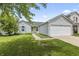 Charming single-story home with a two-car garage, well-maintained lawn, and welcoming curb appeal at 9560 W Campfire Dr, Pendleton, IN 46064
