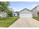 Charming single-story home with a two-car garage, well-maintained lawn, and inviting driveway at 9560 W Campfire Dr, Pendleton, IN 46064