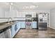 Bright kitchen with stainless steel appliances and two-tone cabinets at 9560 W Campfire Dr, Pendleton, IN 46064