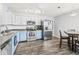 Bright kitchen with stainless steel appliances and two-tone cabinets at 9560 W Campfire Dr, Pendleton, IN 46064