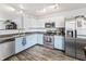 Bright kitchen with stainless steel appliances and two-tone cabinets at 9560 W Campfire Dr, Pendleton, IN 46064