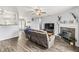 Inviting living room with a cozy fireplace and hardwood floors, perfect for relaxation and entertainment at 9560 W Campfire Dr, Pendleton, IN 46064