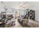Inviting living room with a cozy fireplace and hardwood floors, perfect for relaxation and entertainment at 9560 W Campfire Dr, Pendleton, IN 46064