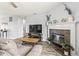 Cozy living room features a fireplace, wood floors and large screen TV at 9560 W Campfire Dr, Pendleton, IN 46064