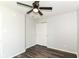 This bedroom features wood-look floors, neutral paint, and a ceiling fan at 9676 W Constellation Dr, Pendleton, IN 46064