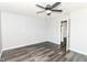 This bedroom features wood-look floors, a ceiling fan, and neutral paint at 9676 W Constellation Dr, Pendleton, IN 46064