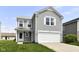 Charming two-story home with a two-car garage, light gray siding, and a well-maintained front lawn at 9676 W Constellation Dr, Pendleton, IN 46064