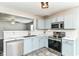 Modern kitchen featuring stainless steel appliances and blue cabinets at 9676 W Constellation Dr, Pendleton, IN 46064