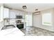 Modern kitchen with sleek countertops, stainless steel appliances, and gray cabinets at 9676 W Constellation Dr, Pendleton, IN 46064