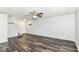 Bright living room with modern wood-look floors, neutral walls, and recessed lighting at 9676 W Constellation Dr, Pendleton, IN 46064